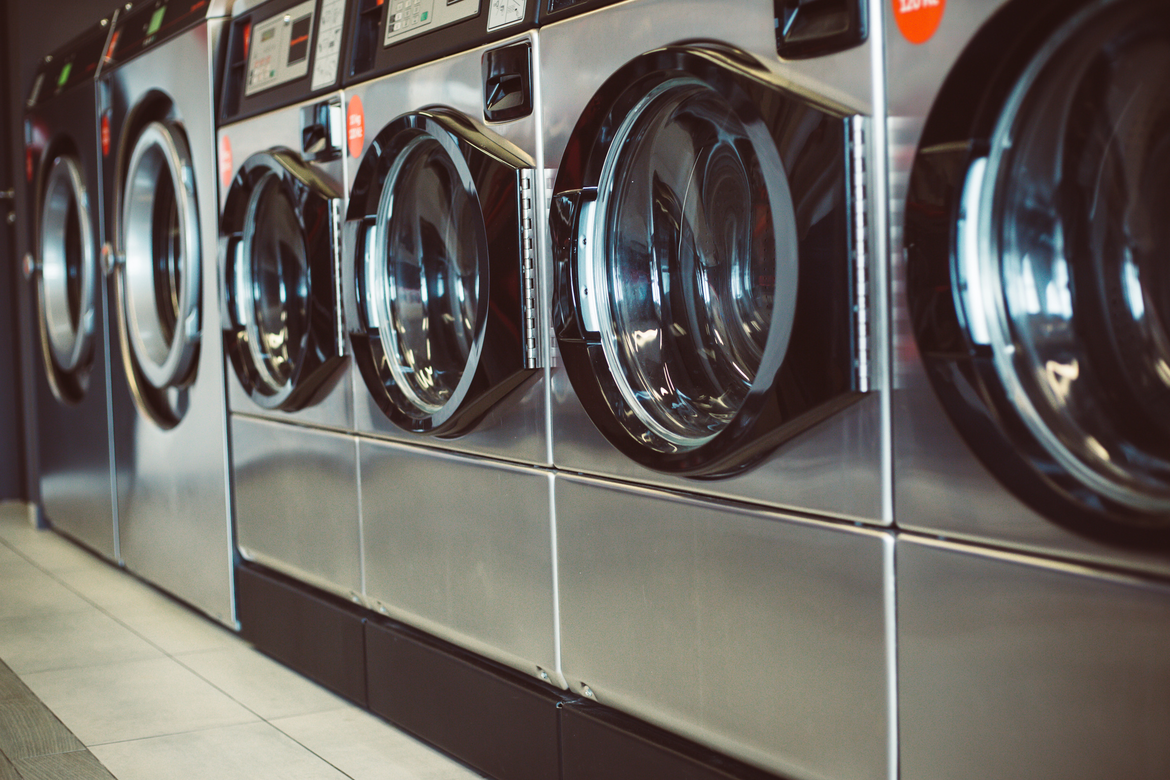 Close up of Washing Machines in a Row in a Laundry, Ready to Cle